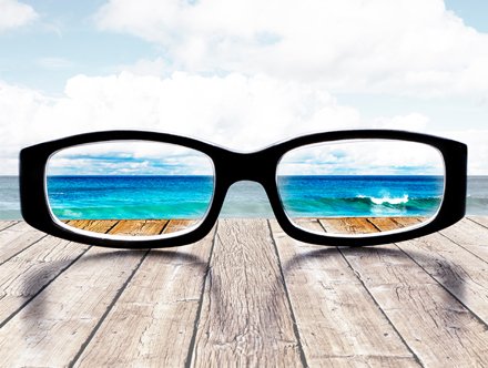 Large format printing blog post - sea view through a pair of glasses