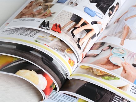 Brochure printing guide - stack of open brochures